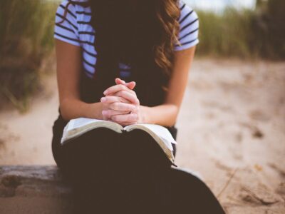 Women reading a Bible.
