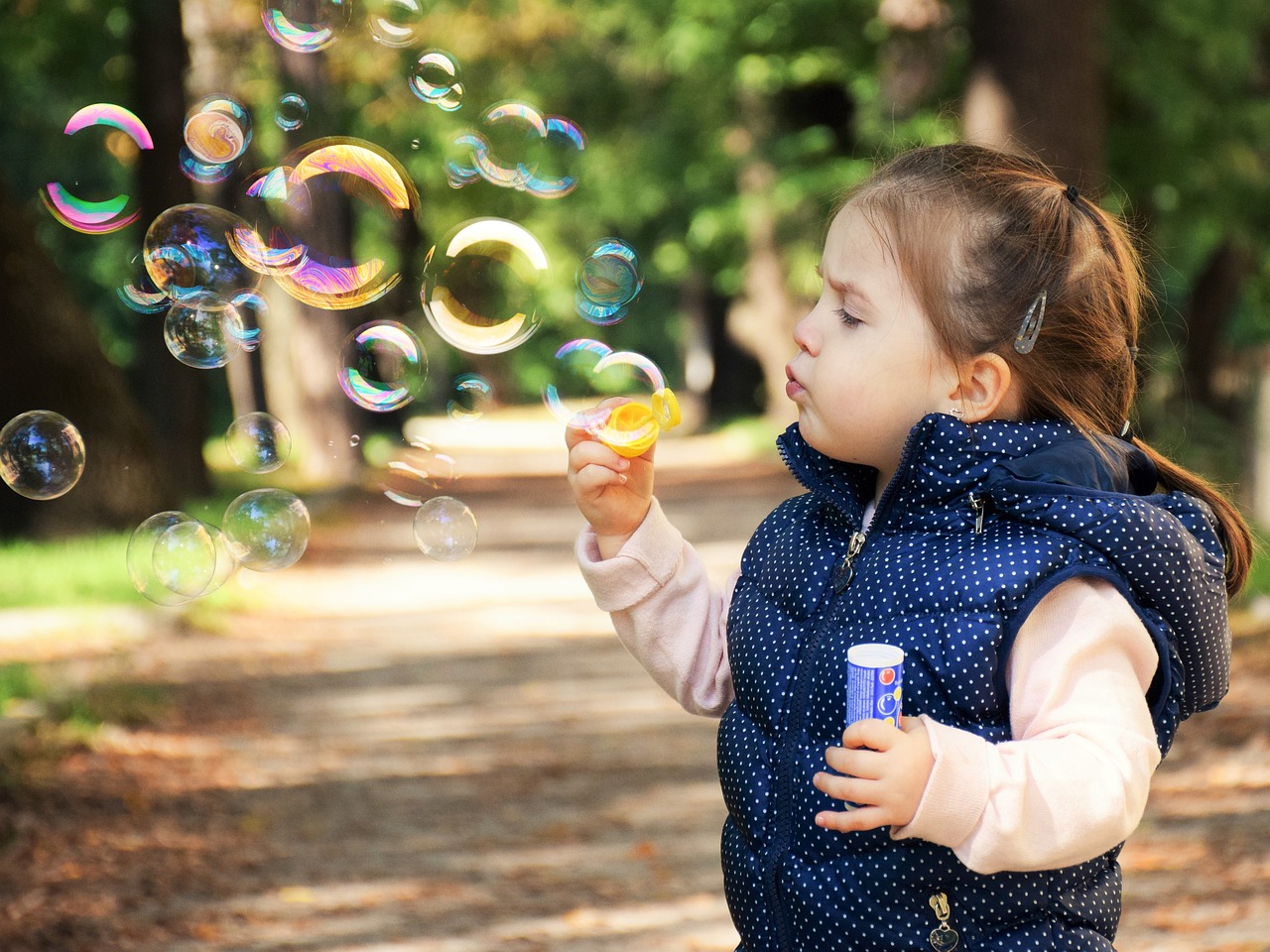 An ordinary moment of blowing bubbles with a child